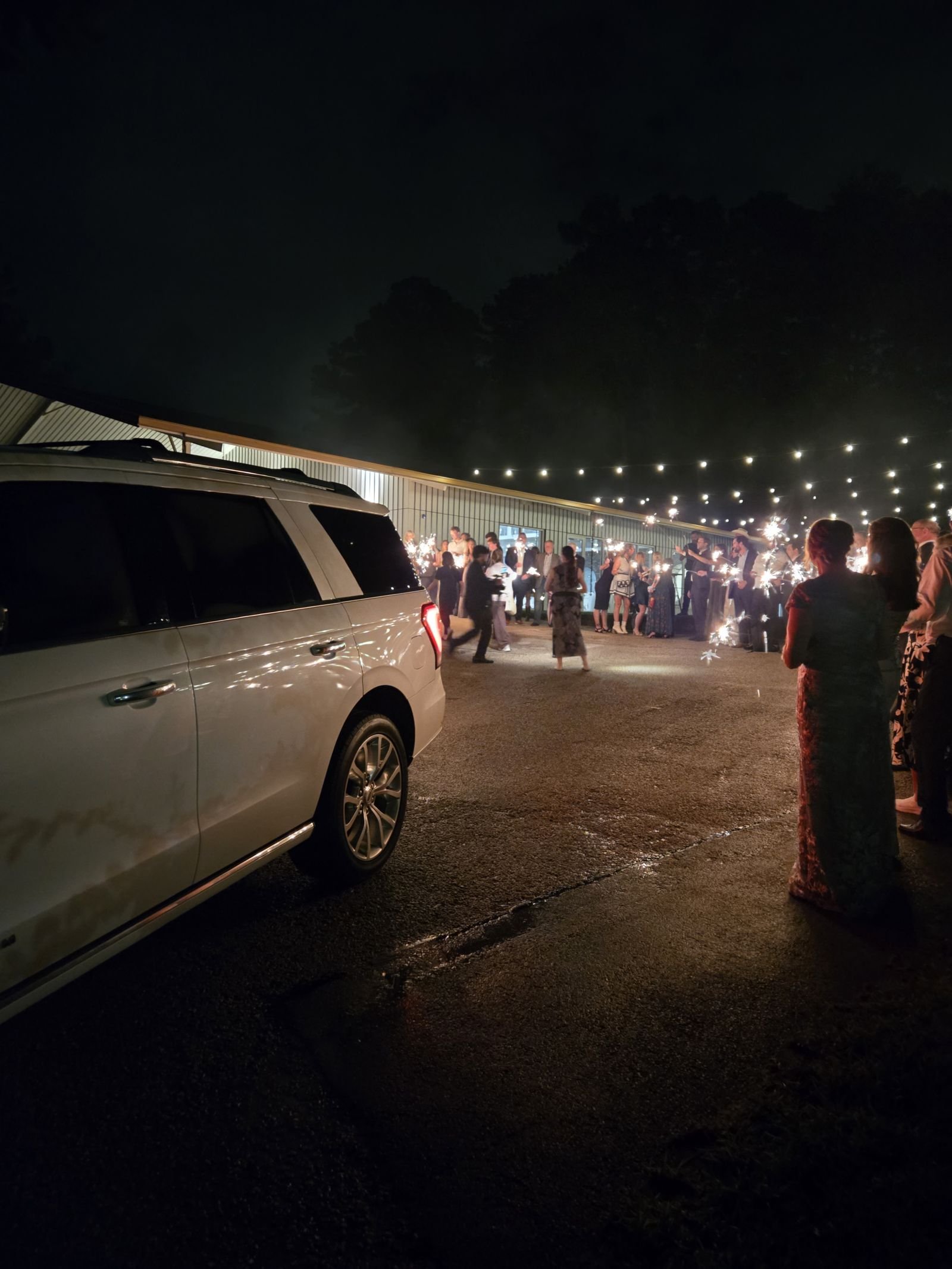 White Ford Expedition waiting during a sparkler send-off at Forever 5 Events in Conroe.