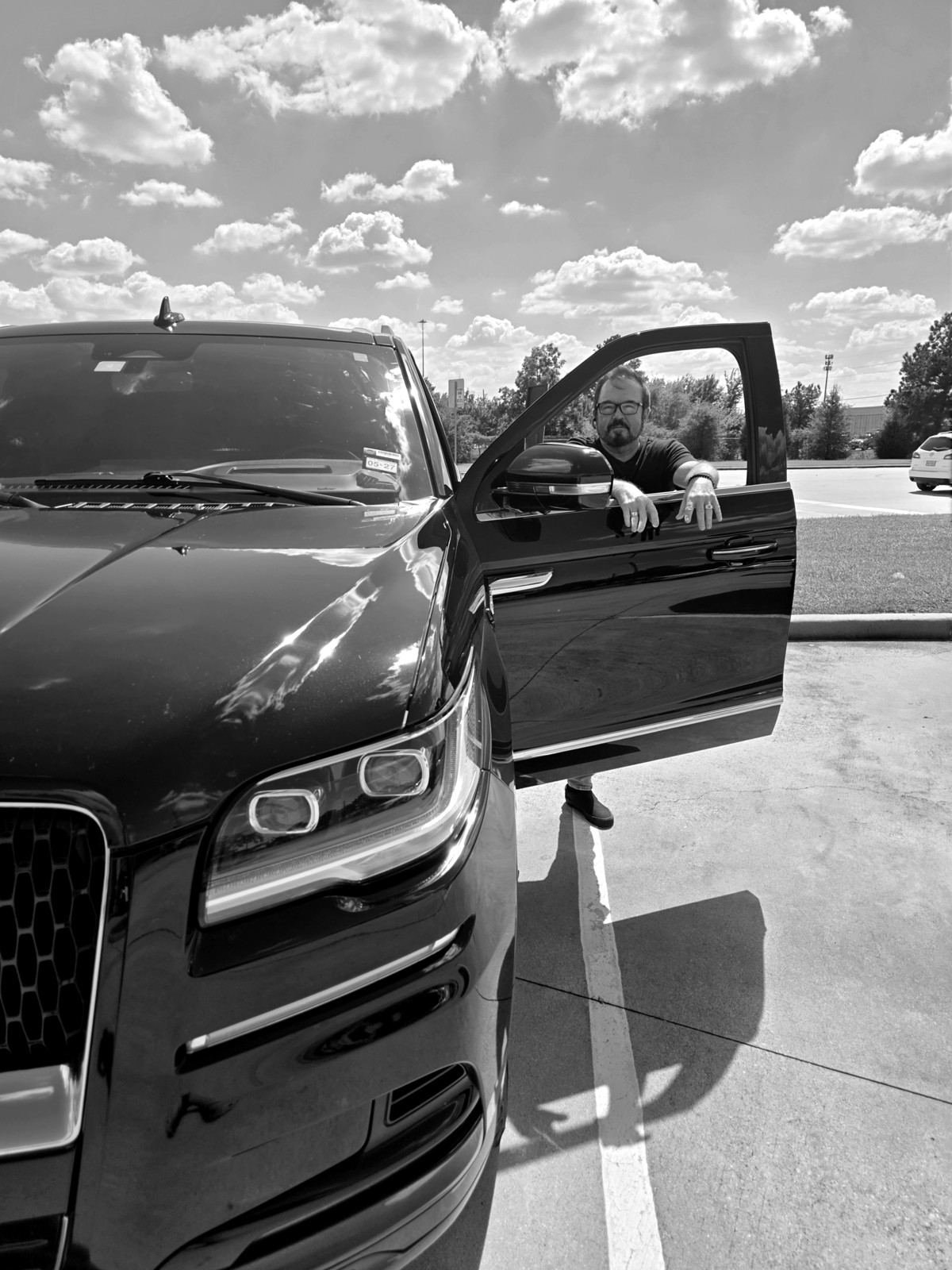 Greg Crawford, owner of Greg's Blackline, with his Lincoln Navigator